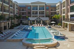 Apartments for rent in Sugar Land, TX - Pool and Patio Area during the Day