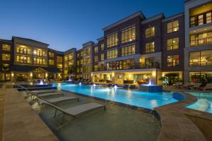 Apartment Rentals in Sugar Land, TX - Pool and Patio Area with Fountains at Night