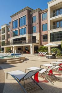 Apartment Rentals in Sugar Land, TX - Pool and Patio Area with Lounge Chairs