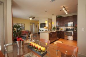 One Bedroom Apartments in Sugar Land, Texas - Model Dining Room with View to Living Room and Kitchen
