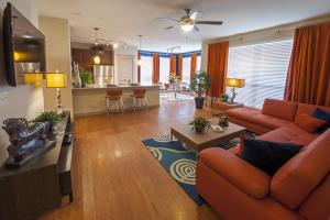 One Bedroom Apartments in Sugar Land, Texas - Model Living Room with View to Kitchen and Dining Room