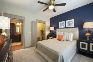 Two Bedroom Apartments in Sugar Land, Texas - Model Bedroom and Closet with View to Bathroom